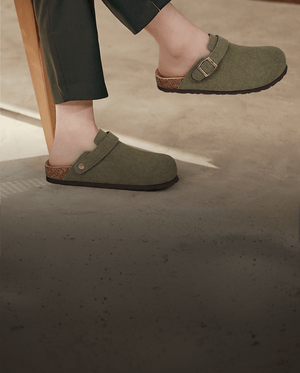 Olive felt clogs worn with tailored trousers